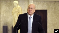 Lebanese Prime Minister-designate Najib Mikati speaks during a press conference at the presidential palace in Baabda, east of Beirut, 25 Jan 2011