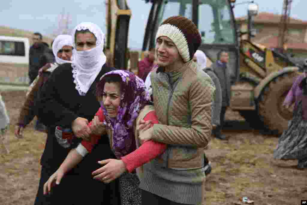 A mourner cries at the funeral of Lokman Acikgoz and his two sons in Cinar, in the mostly-Kurdish Diyarbakir province in southeastern Turkey. The members of the family were among several people killed when Kurdish militants detonated a car bomb at a police station in Cinar.