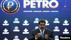 FILE - Venezuelan President Nicolas Maduro presides over the international launch event for the petro — the cryptocurrency developed by his presidential administration — in Caracas, Venezuela, Oct. 1, 2018.