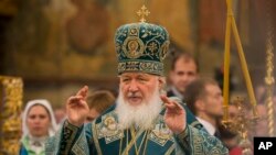FILE - Russia's Patriarch Kirill officiates at a religious service inside the Cathedral of the Assumption at Cathedral Square in Moscow, Russia, Nov. 4, 2015.