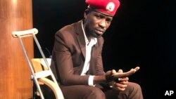 FILE - Ugandan pop star-turned-lawmaker Bobi Wine attends the National Press Club in Washington, Sept. 6, 2018. 