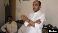 FILE - Ali Haider Gilani, son of former Pakistani Prime Minister Yusuf Raza Gilani, at a campaign meeting at a house on the outskirts of Multan, May 9, 2013, before his abduction by unidentified gunman.