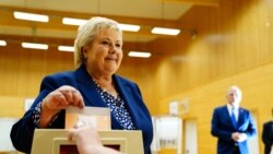 Norwegian Prime Minister Erna Solberg, leader of the Conservative Party, casts her vote in the 2021 parliamentary election at Skjold School in her home town, in Bergen, Norway, September 13, 2021. (NTB/Hakon Mosvold Larsen via Reuters)