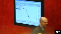 FILE - A Russian broker is seen inside Russia's MICEX stock market in Moscow.