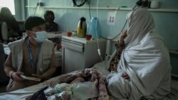 Islamia, 5-month-old and severely malnourished, lies on a bed at the neonatal intensive care unit of the Mirwais regional hospital.