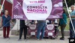 People vote on whether to continue with the $13 billion airport to replace the current Benito Juarez International Airport, in Mexico City, Oct. 28, 2018.