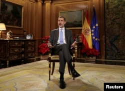 Spain's King Felipe VI delivers his traditional Christmas address at Zarzuela Palace in Madrid, Spain, December 23, 2017 in this photo released Dec. 24, 2017.