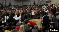 U.S. Democratic presidential candidate Hillary Clinton speaks at the "African Americans for Hillary" rally as protesters from "Black Lives Matter" (L) interrupt her speech at Clark Atlanta University in Atlanta, Georgia October 30 2015.