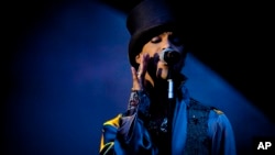 FILE - American singer and songwriter Prince performs on the Isle of Amager in Copenhagen, Denmark, Aug. 6, 2011. 