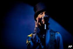 American singer and songwriter Prince performs on the Isle of Amager in Copenhagen, Denmark, Aug. 6, 2011.