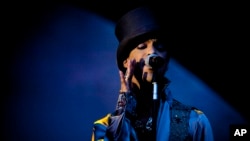 FILE - American singer and songwriter Prince performs on the Isle of Amager in Copenhagen, Denmark, Aug. 6, 2011. 