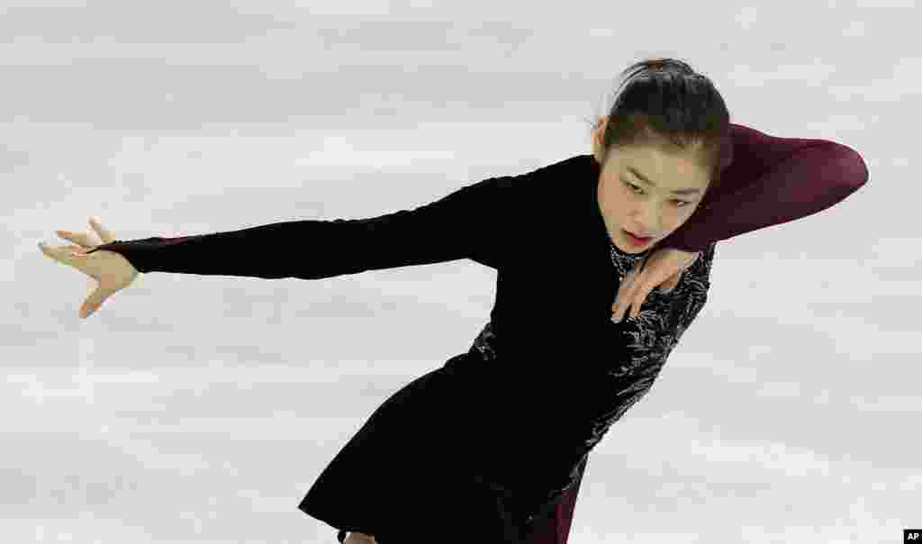 Yuna Kim of South Korea skates during a practice session at the Iceberg Skating Palace during the 2014 Winter Olympics, Sochi, Russia, Feb. 20, 2014.