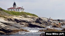 In this July 7, 2006, fishermen cast on the rocky shore at the Beavertail Lighthouse, the third-oldest lighthouse in America, at the tip of Beavertail State Park, on Narragansett Bay, in Jamestown, R.I.