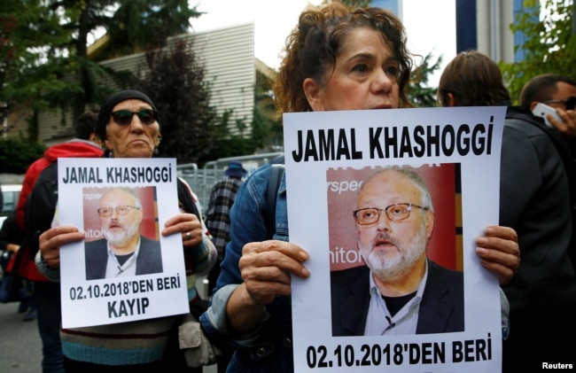 Human rights activists hold pictures of Saudi journalist Jamal Khashoggi during a protest outside the Saudi Consulate in Istanbul, Turkey, Oct. 9, 2018.