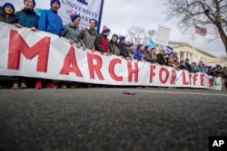 Anti-abortion activists march past the Supreme Court in Washington, Jan. 27, 2017, during the annual March for Life.