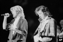 FILE - The pop duo Wham! performs in Peking before a capacity audience of Chinese and foreign fans, April 7, 1985.