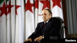 FILE - President Abdelaziz Bouteflika looks on during a swearing-in ceremony in Algiers, Algeria. 
