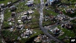FILE - Destroyed communities are seen in the aftermath of Hurricane Maria in Toa Alta, Puerto Rico, Sept. 28, 2017. 