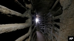 FILE - The Catacombs of Priscilla stretch for kilometers underground in Rome, Nov. 19, 2013.