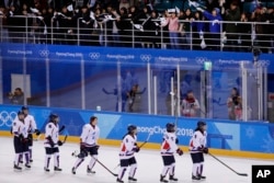 Fans cheer the combined Koreas team after the classification round of the women's hockey game against Sweden at the 2018 Winter Olympics in Gangneung, South Korea, Feb. 20, 2018. Sweden won 6-1.