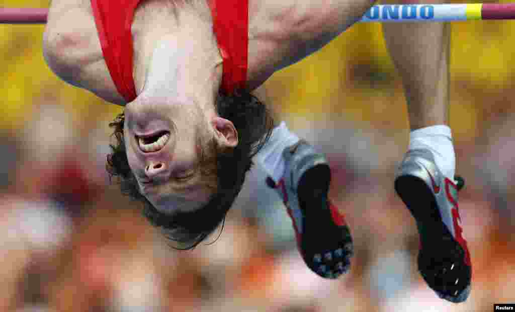 Ivan Ukhov of Russia clears the bar in the men&#39;s high jump final during the IAAF World Athletics Championships at the Luzhniki stadium in Moscow, Russia. 