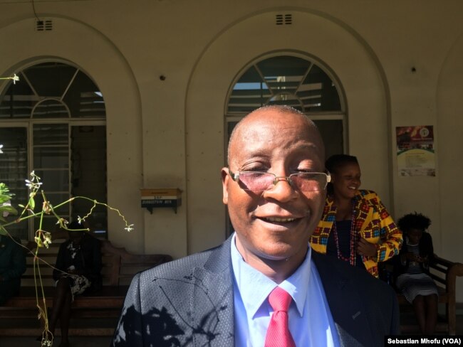 Ziyambi Ziyambi, shown in July 2017, is a parliament member of the ruling ZANU-PF party. He says he sees nothing wrong with the new law that allows President Robert Mugabe to handpick Zimbabwe’s top judges.