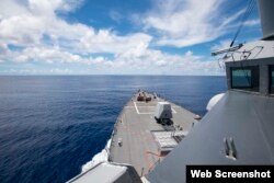 The USS Ralph Johnson (DDG 114) operates in waters near the Spratly Islands on July 14, 2020. (Anthony Collier/U.S. Navy)