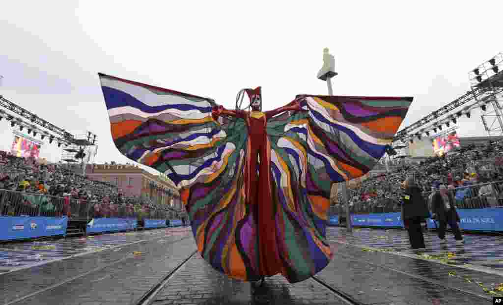 A participant takes part in the flower parade during the 134th Nice carnival edition, Feb. 17, 2018, in Nice, southeastern France.