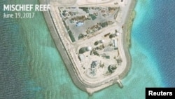 Construction is shown on Mischief Reef in the Spratly Islands, the disputed South China Sea, in this June 19, 2017, satellite image released by CSIS Asia Maritime Transparency Initiative at the Center for Strategic and International Studies (CSIS) to Reuters on June 29, 2017. 