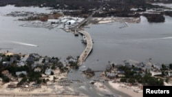 The view of storm damage over the Atlantic Coast in Seaside Heights, N.J., Wednesday, Oct. 31, 2012, from a helicopter traveling behind the helicopter carrying President Obama and New Jersey Gov. Chris Christie.