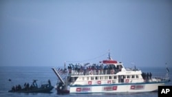 Israeli soldiers raid a ship as the navy intercepts a Gaza-bound aid flotilla in the Mediterranean Sea, 31 May 2010