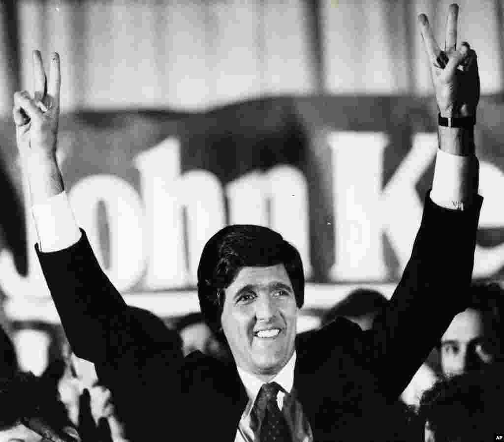 John Kerry raises his arms in victory in this November 6, 1984 photo in a Boston hotel where he celebrated his defeat over Ray Shamie, in the Senate race.
