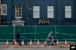 A police cordon and fence are placed outside a Zizzi restaurant near the area where former Russian double agent Sergei Skripal and his daughter were found critically ill following exposure to the Russian-developed nerve agent Novichok in Salisbury, Englan