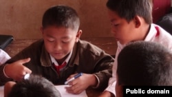 Children working together at school in Laos.