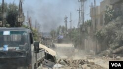 FILE - Neighborhoods in west Mosul, Iraq, are devastated after the fighting, and many Iraqi-controlled areas have almost no families left. June 4, 2017. (H. Murdock/VOA)