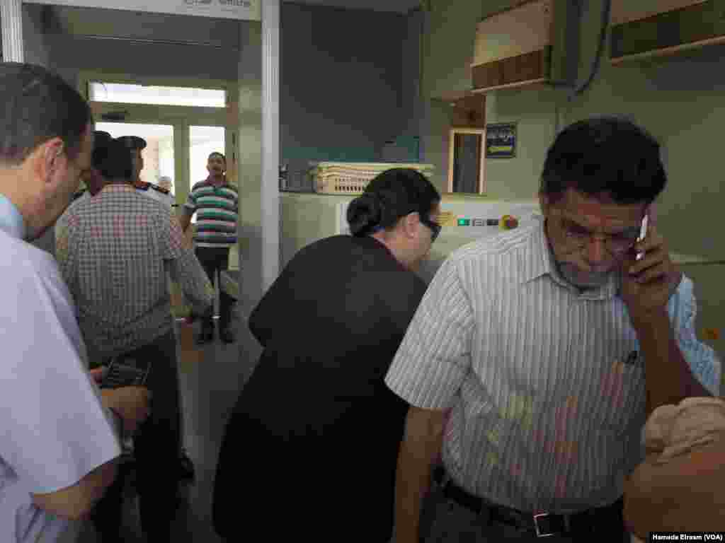 Amgad's sister on of the Egyptian passengers who is missing on the flight of Egyptair getting checked while getting into Egypt air in flight service building in Nassr city in Cairo, Egypt, May 19, 2016.