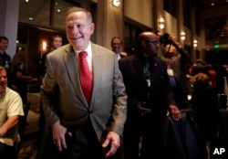 FILE- In this Sept. 26, 2017, photo, former Alabama Chief Justice and U.S. Senate candidate Roy Moore greets supporters before his election party in Montgomery, Alabama.