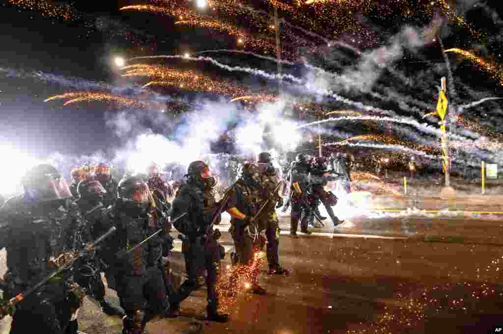 Police use chemical irritants and crowd control munitions to disperse protesters during a demonstration in Portland, Oregon, Sept. 5, 2020.