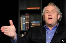 Andrew Breitbart, gestures during an interview with the Associated Press in New York, June 7, 2011.