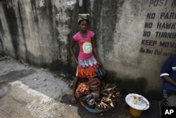 FILE - Thousands of Nigeria's girls have to quit school to work as petty traders and support their families.