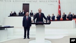 Turkey's President Recep Tayyip Erdogan takes the oath of office for his second term as president, at the parliament in Ankara, July 9, 2018.