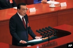 Chinese Premier Li Keqiang delivers his work reports at the opening session of the China's National People's Congress, at the Great Hall of the People in Beijing, China, March 5, 2019.