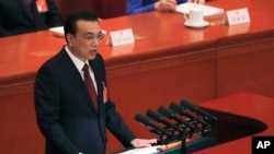 Chinese Premier Li Keqiang delivers his work reports at the opening session of the China's National People's Congress, at the Great Hall of the People in Beijing, China, March 5, 2019.