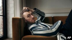 FILE - In this Nov. 2, 2017 file photo, musician Sam Smith poses for a portrait in New York to promote his latest album, "The Thrill of It All." Smith, who launched the North American leg of his tour this week, says though his past shows have been melancholy, his new ones are all about love. 