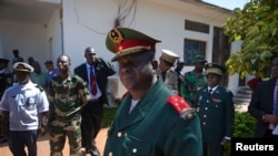 Guinea-Bissau armed forces chief-of-staff General Antonio Indjai (C) leaves a meeting with the president and the regional body of the Economic Community of West African States (ECOWAS) in the capital Bissau, Nov. 7, 2012. 