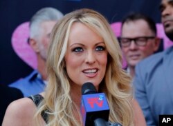 FILE - Stormy Daniels speaks during a ceremony for her in West Hollywood, Calif., May 23, 2018.