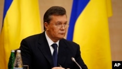 Ukraine's ousted President Viktor Yanukovych speaks at a news conference in Rostov-on-Don, a city in southern Russia, Friday, February 28, 2014. (AP Photo/Pavel Golovkin)