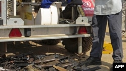 FILE - United Nations Mine Action Service (UNMAS) personnel destroy weapons at the U.N. Mission in South Sudan (UNMISS) base in Juba, Dec. 14, 2014.