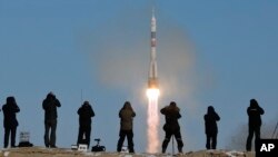 The Soyuz-FG rocket booster with Soyuz MS-07 space ship carrying a new crew to the International Space Station, ISS, blasts off at the Russian leased Baikonur cosmodrome, Kazakhstan, Sunday, Dec. 17, 2017. 