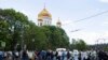 Russian Orthodox believers cross the road to line up to kiss the relics of Saint Nicholas that were brought from an Italian church where they have lain for 930 years, in the Christ the Savior Cathedral in Moscow, Russia. The photo was taken on May 26, 201